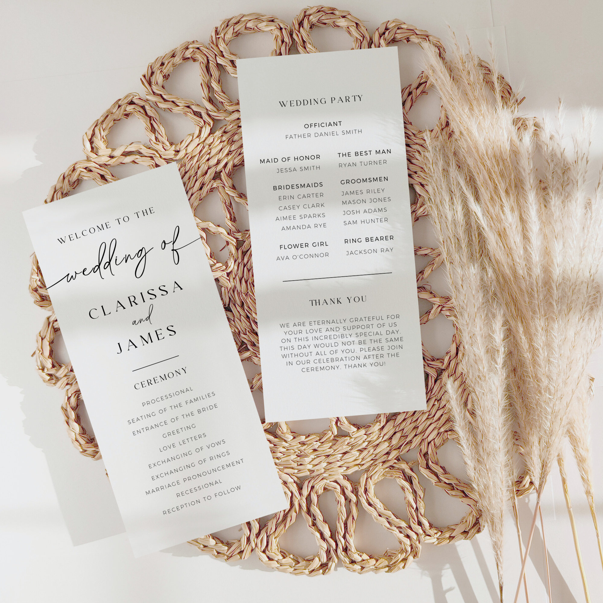 Minimalist wedding ceremony programs on a woven mat with pampas grass.