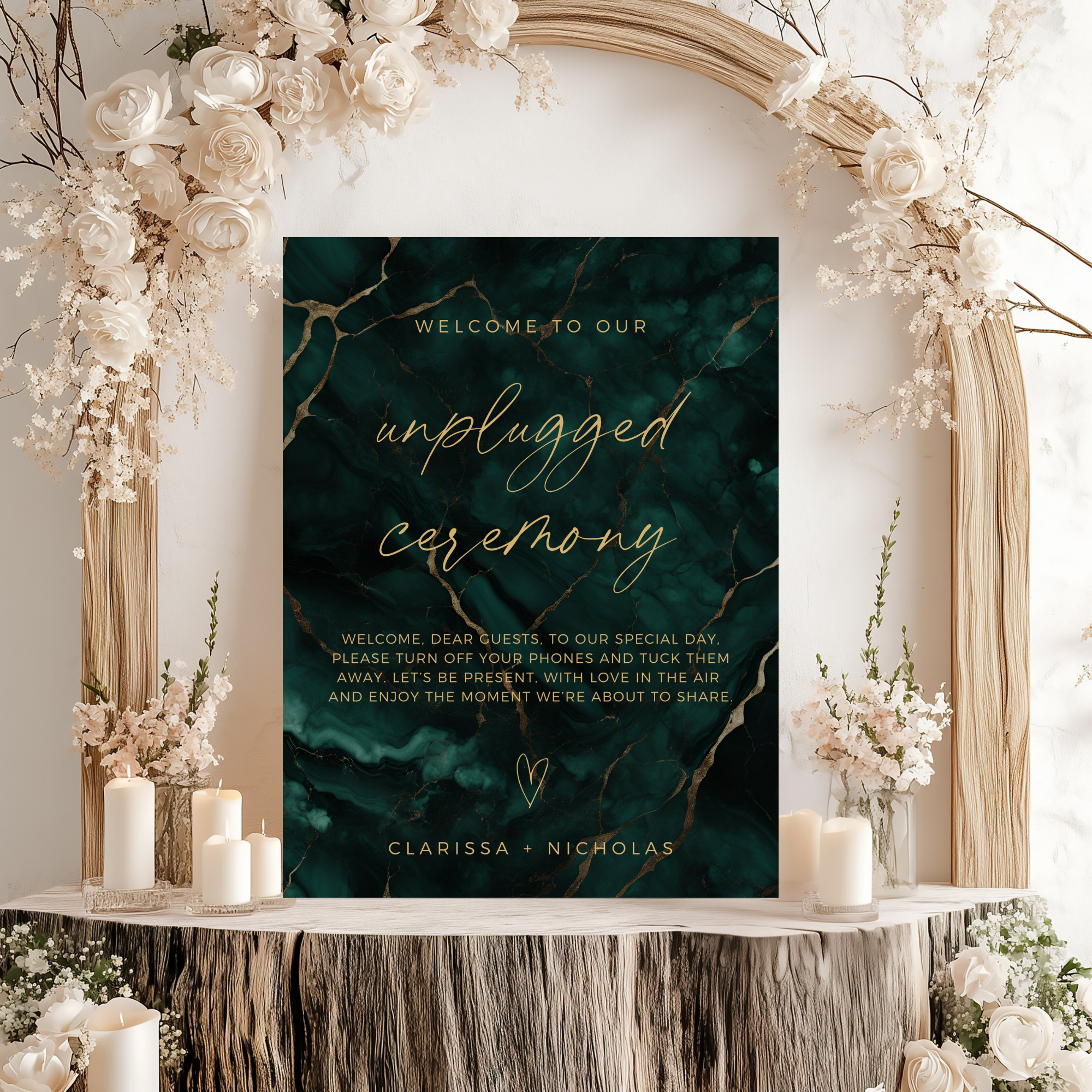 Poster sign for an unplugged ceremony with decorative flowers and candles on a table.