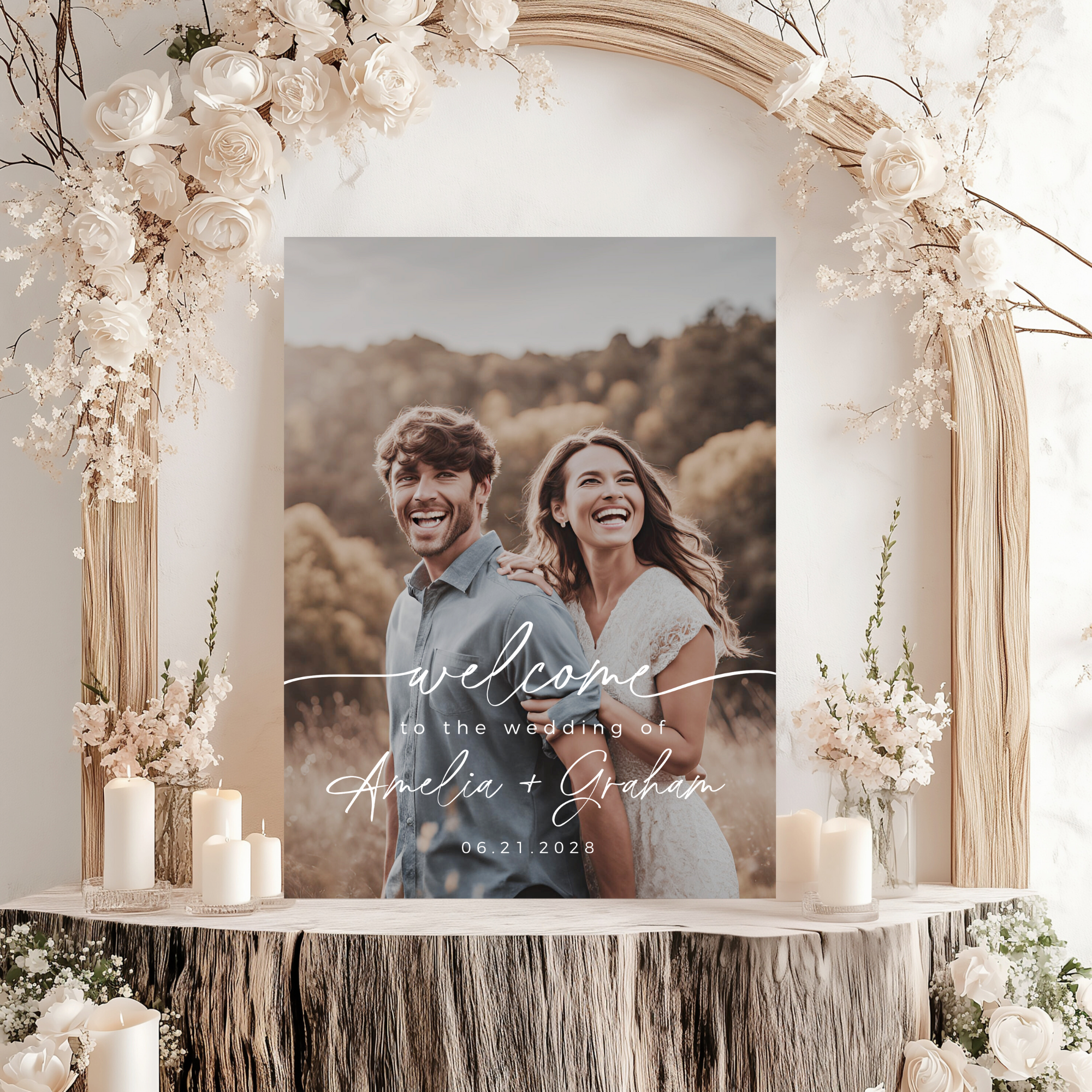 Poster of a couple with 'welcome to the wedding' text, surrounded by floral decorations.